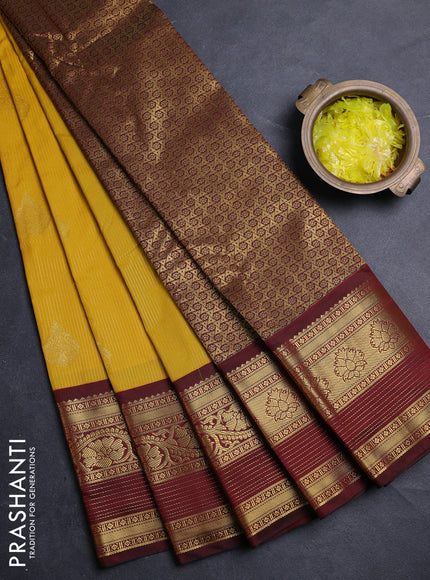 Semi kanchipuram silk saree yellow and deep maroon with allover zari weaves & buttas and long zari woven korvai border