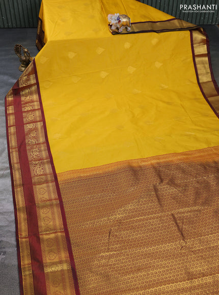 Semi kanchipuram silk saree yellow and deep maroon with allover zari weaves & buttas and long zari woven korvai border