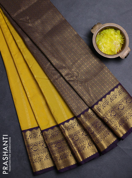 Semi kanchipuram silk saree yellow and deep purple with allover zari weaves & buttas and zari woven korvai border
