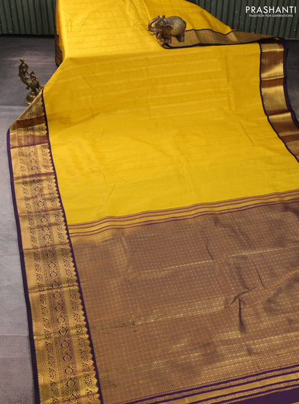 Semi kanchipuram silk saree yellow and deep purple with allover zari weaves & buttas and zari woven korvai border