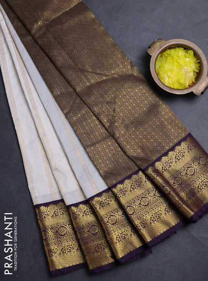 Semi kanchipuram silk saree off white and deep purple with allover zari weaves & buttas and zari woven korvai border