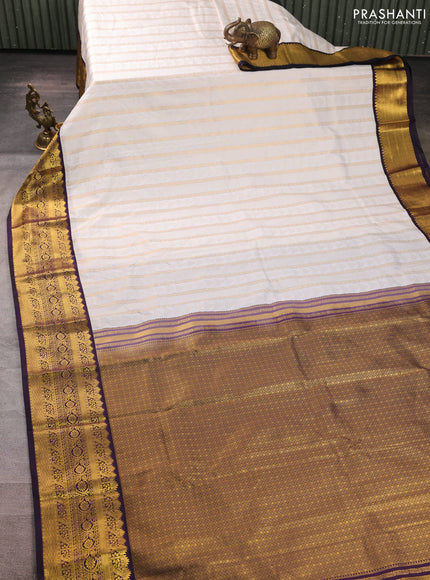 Semi kanchipuram silk saree off white and deep purple with allover zari weaves & buttas and zari woven korvai border