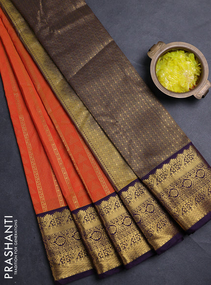 Semi kanchipuram silk saree orange and deep purple with allover zari weaves & buttas and zari woven korvai border