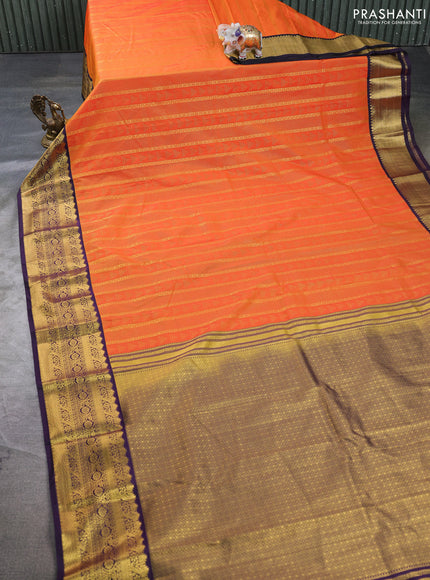 Semi kanchipuram silk saree orange and deep purple with allover zari weaves & buttas and zari woven korvai border