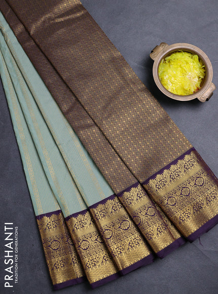 Semi kanchipuram silk saree pastel green and deep purple with allover zari weaves & buttas and zari woven korvai border