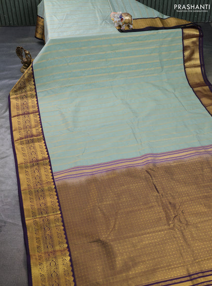 Semi kanchipuram silk saree pastel green and deep purple with allover zari weaves & buttas and zari woven korvai border