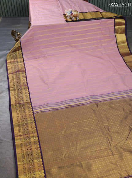 Semi kanchipuram silk saree pastel pink and deep purple with allover zari weaves & buttas and zari woven korvai border