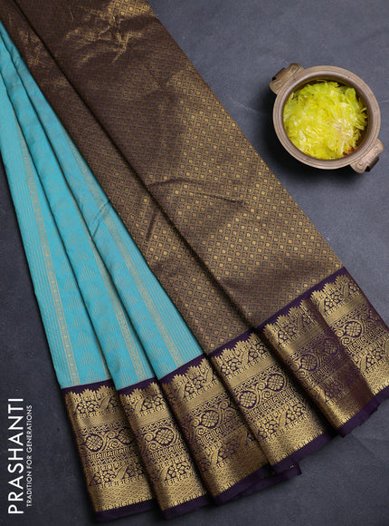 Semi kanchipuram silk saree teal blue and deep purple with allover zari woven buttas and zari woven korvai border