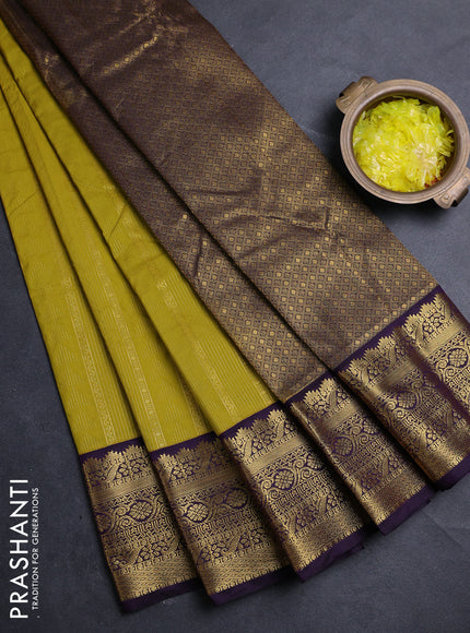 Semi kanchipuram silk saree light green and deep purple with allover zari woven buttas and zari woven korvai border