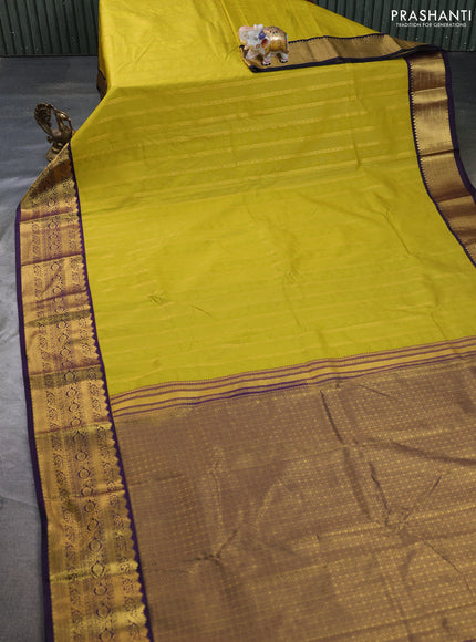 Semi kanchipuram silk saree light green and deep purple with allover zari woven buttas and zari woven korvai border