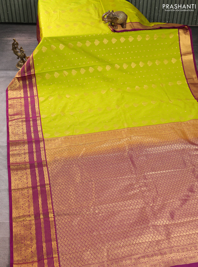Semi kanchipuram silk saree light green and purple with allover zari woven buttas and zari woven korvai border