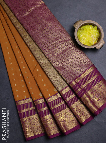 Semi kanchipuram silk saree dark mustard and purple with allover zari woven buttas and zari woven korvai border