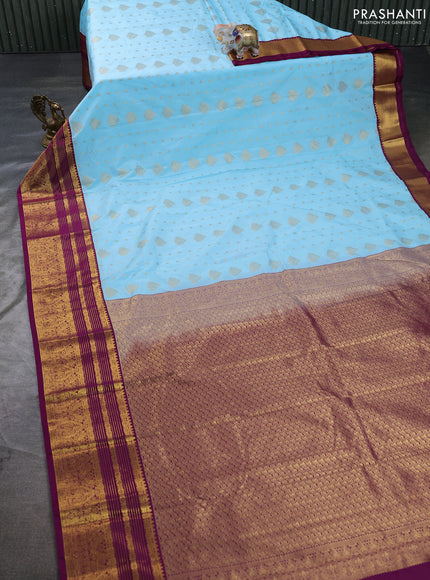 Semi kanchipuram silk saree teal blue and purple with allover zari woven buttas and zari woven korvai border
