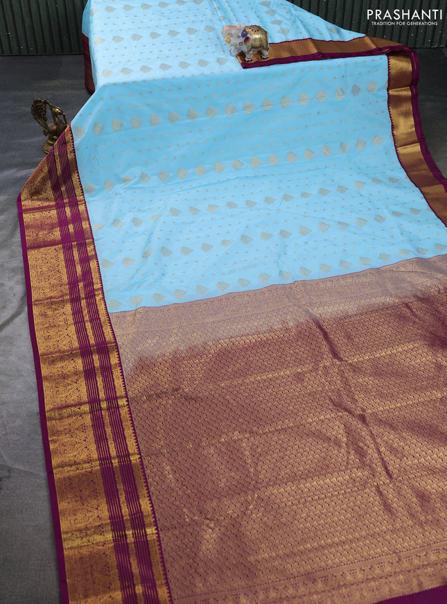 Semi kanchipuram silk saree teal blue and purple with allover zari woven buttas and zari woven korvai border