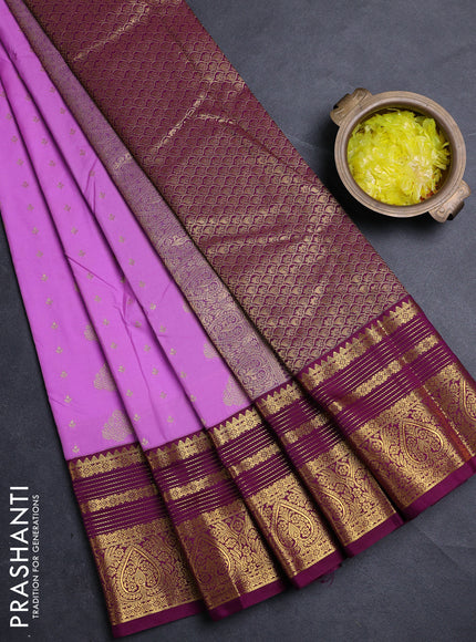 Semi kanchipuram silk saree lavender and purple with allover zari woven buttas and zari woven korvai border