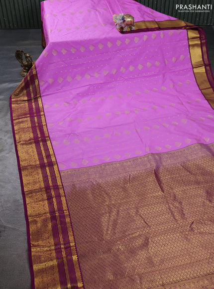 Semi kanchipuram silk saree lavender and purple with allover zari woven buttas and zari woven korvai border