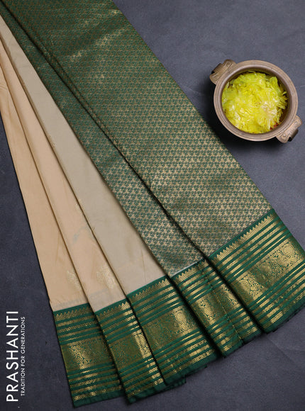 Semi kanchipuram silk saree beige and green with zari woven buttas and zari woven korvai border