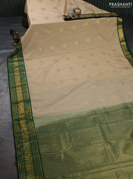 Semi kanchipuram silk saree beige and green with zari woven buttas and zari woven korvai border