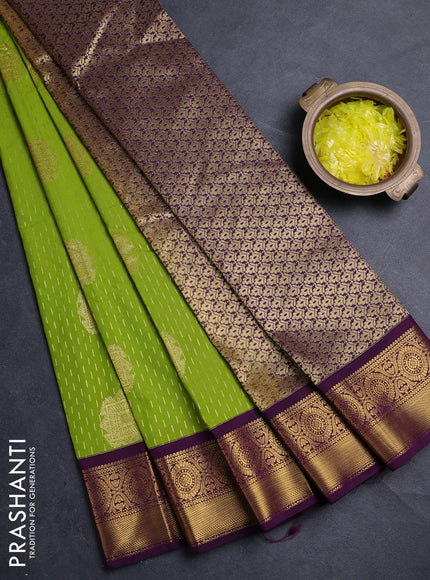 Semi kanchipuram silk saree light green and deep purple with allover zari woven buttas and zari woven border