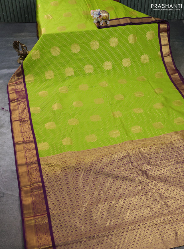Semi kanchipuram silk saree light green and deep purple with allover zari woven buttas and zari woven border