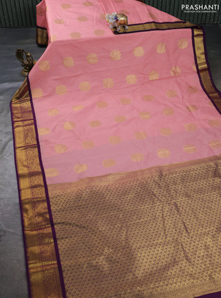 Semi kanchipuram silk saree peach pink and deep purple with allover zari woven buttas and zari woven border
