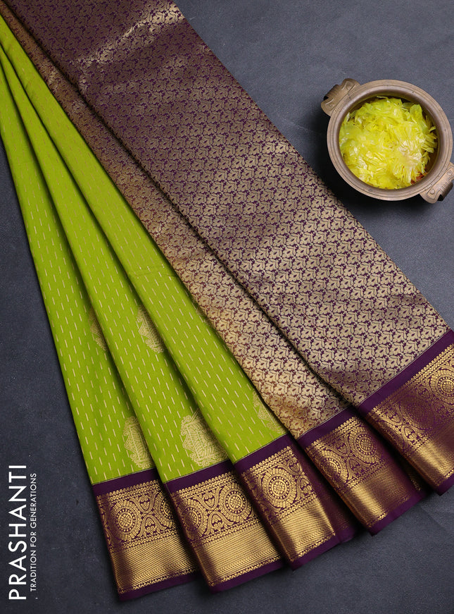 Semi kanchipuram silk saree light green and purple with allover zari woven buttas and zari woven border