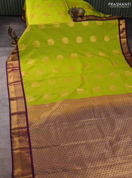 Semi kanchipuram silk saree light green and purple with allover zari woven buttas and zari woven border