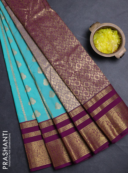 Semi kanchipuram silk saree teal blue and purple with allover zari woven buttas and long zari woven border