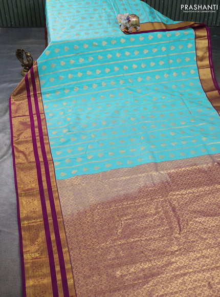Semi kanchipuram silk saree teal blue and purple with allover zari woven buttas and long zari woven border