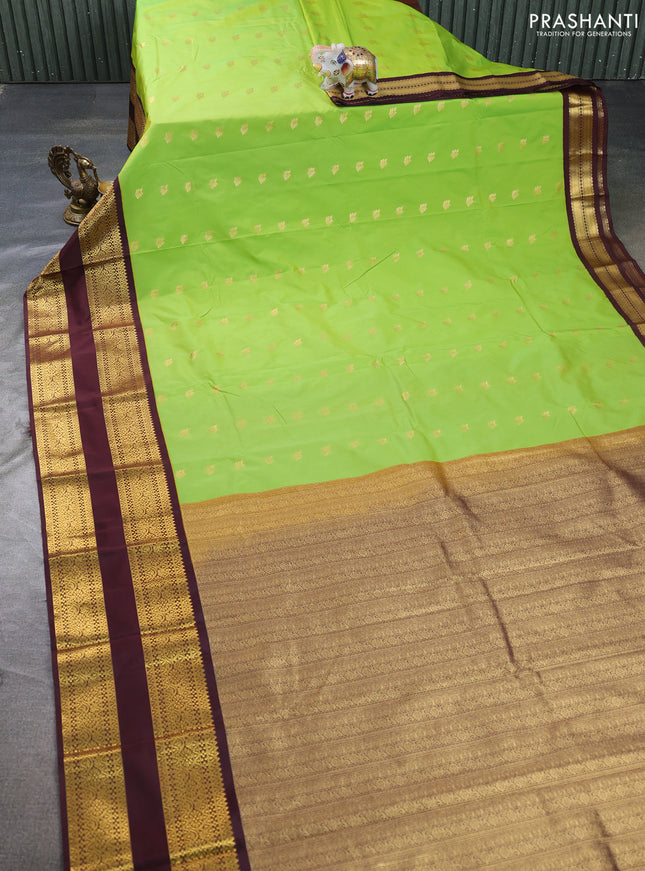 Semi kanchipuram silk saree light green and deep maroon with allover zari woven buttas and long rettapet zari woven border