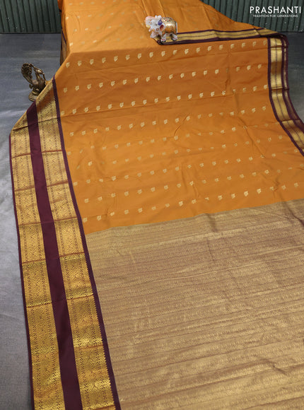 Semi kanchipuram silk saree mustard yellow and deep maroon with allover zari woven buttas and long rettapet zari woven border
