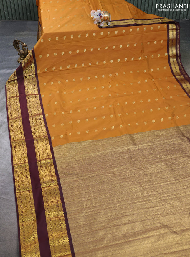 Semi kanchipuram silk saree mustard yellow and deep maroon with allover zari woven buttas and long rettapet zari woven border