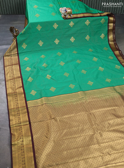 Semi kanchipuram silk saree green and deep maroon with allover zari weaves & buttas and zari woven border