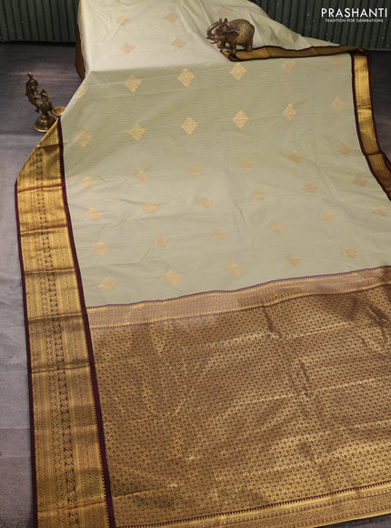 Semi kanchipuram silk saree mild pista green and deep maroon with allover zari weaves & buttas and zari woven border