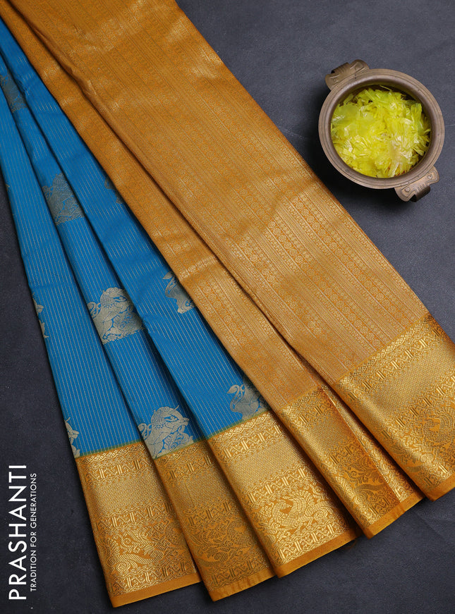 Semi kanchipuram silk saree cs blue and mustard yellow with allover zari weaves & buttas and zari woven border