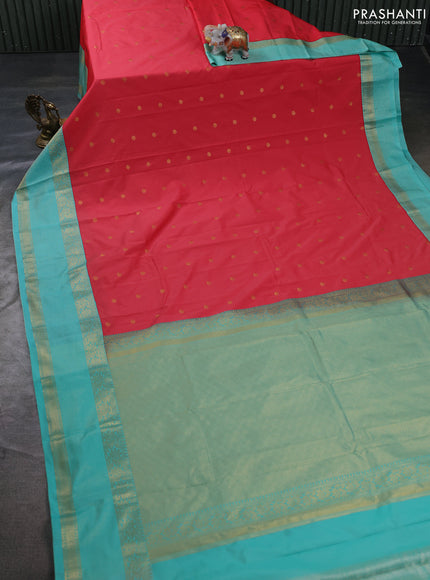 Semi kanchipuram silk saree tomato pink and teal green with allover zari woven buttas and zari woven korvai border