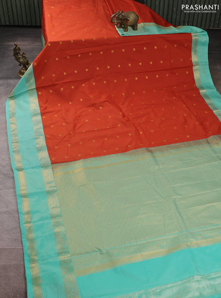 Semi kanchipuram silk saree rust shade and teal green with allover zari woven buttas and zari woven border