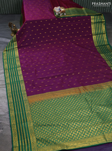 Semi kanchipuram silk saree magenta pink and green with allover temple zari woven buttas and zari woven border