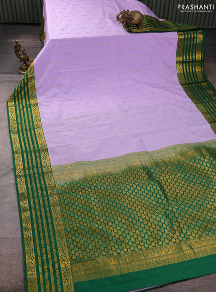 Semi kanchipuram silk saree lavender and green with allover temple zari woven buttas and zari woven border