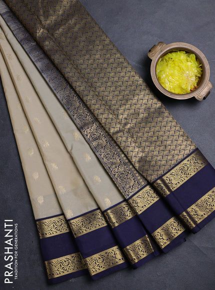 Semi kanchipuram silk saree beige and navy blue with allover zari woven buttas and rettapet zari woven border