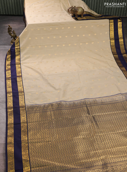 Semi kanchipuram silk saree beige and navy blue with allover zari woven buttas and rettapet zari woven border