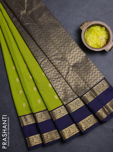 Semi kanchipuram silk saree light green and navy blue with allover zari woven buttas and rettapet zari woven border