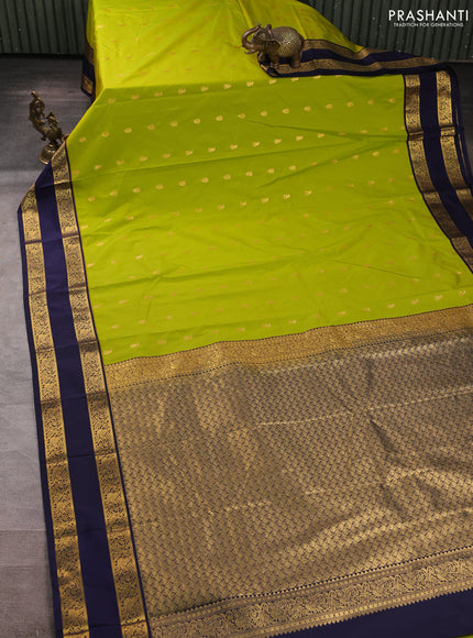 Semi kanchipuram silk saree light green and navy blue with allover zari woven buttas and rettapet zari woven border