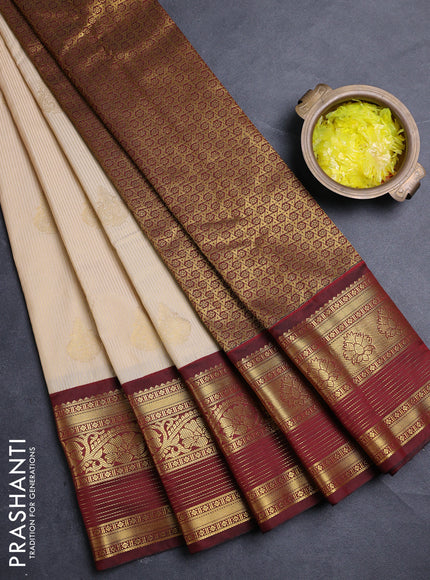 Semi kanchipuram silk saree cream and deep maroon with allover zari weaves & buttas and zari woven border
