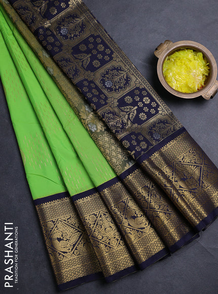Semi kanchipuram silk saree light green and navy blue with allover zari woven buttas and long zari woven border