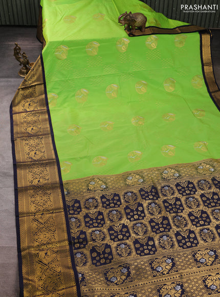 Semi kanchipuram silk saree light green and navy blue with allover zari woven buttas and long zari woven border