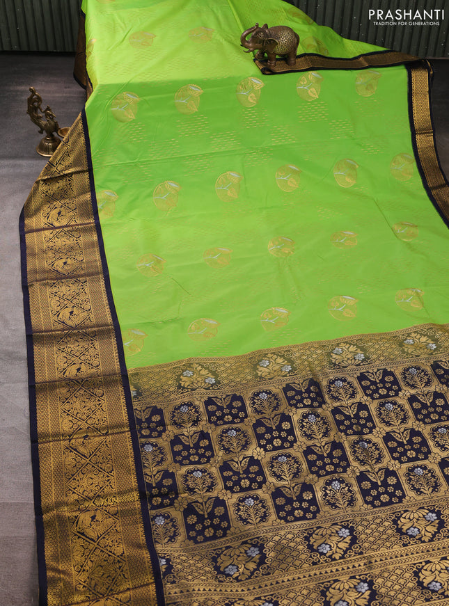 Semi kanchipuram silk saree light green and navy blue with allover zari woven buttas and long zari woven border