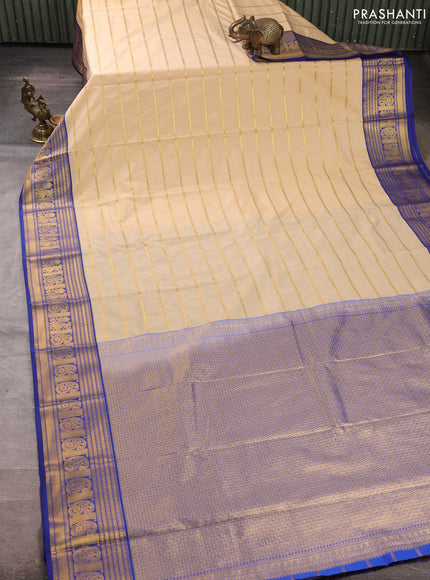 Semi kanchipuram silk saree cream and blue with allover zari stripe pattern and zari woven border