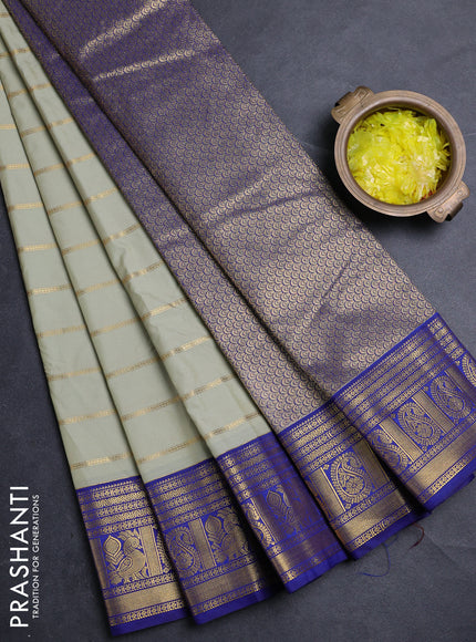 Semi kanchipuram silk saree mild pista green and blue with allover zari stripe pattern and zari woven border
