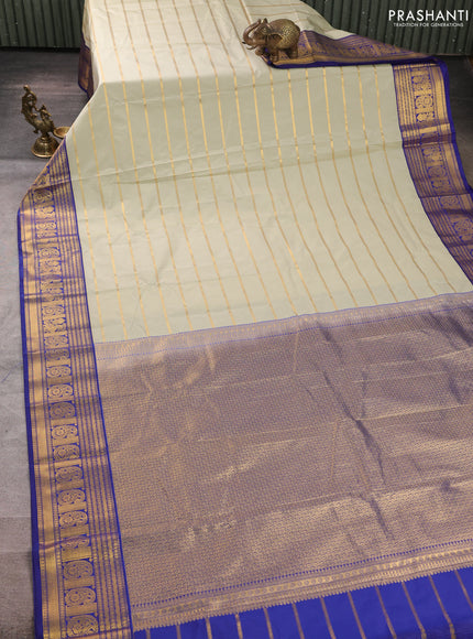 Semi kanchipuram silk saree mild pista green and blue with allover zari stripe pattern and zari woven border